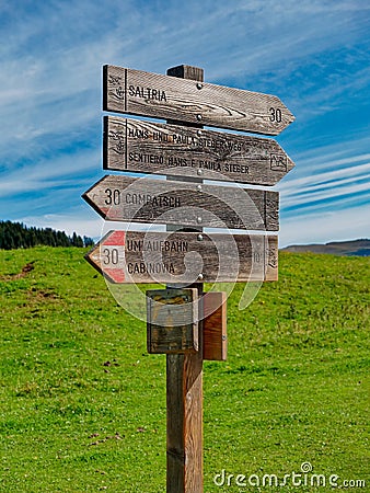 Wooden signposts on a route in the mountain in summer Stock Photo