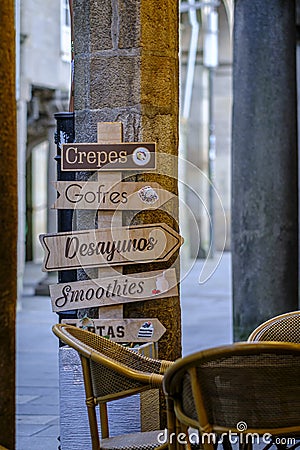 Wooden signs of a cafeteria announcing breakfasts. Editorial Stock Photo