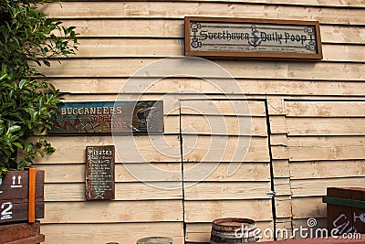 Wooden signs on outside wall Editorial Stock Photo