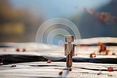 Wooden solitude, lonely figure on a wooden surface, blurred background Stock Photo