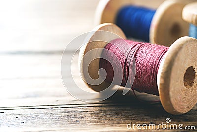 Wooden spools of thread close-up. Selective focus. Rendered image. Copy space Stock Photo