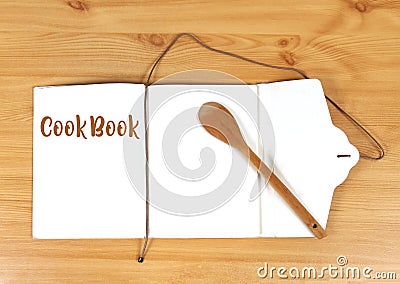 Wooden spoon open cookbook Stock Photo