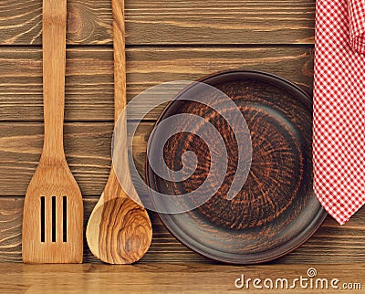 Wooden spoon, plate and napkin Stock Photo