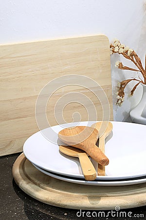 Wooden spoon with utensil and wooden cutting board in kitchen ro Stock Photo