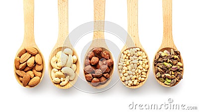 Wooden spoons with different nuts on white background Stock Photo