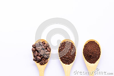 Wooden spoons filled with coffee bean and crushed ground coffee Stock Photo