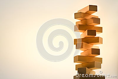 Wooden stack tower from wood blocks toy on abstract background Stock Photo
