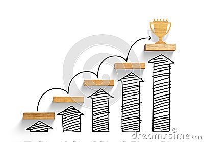 Wooden staircase to reach goal and win trophy with increase graph and arrow Stock Photo