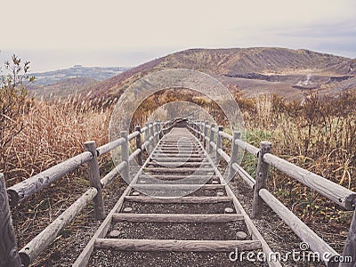 Wooden stairs on Mt. Usu or Ususan at Hokkaido, Japan. With retro photo filter. Stock Photo