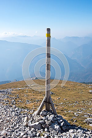 A wooden stake with alpine scenery, Puchberg am Schneeberg, Austria Stock Photo