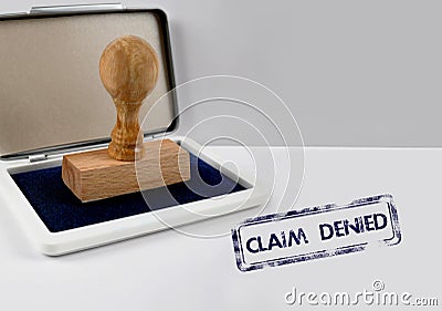 Wooden stamp CLAIM DENIED Stock Photo