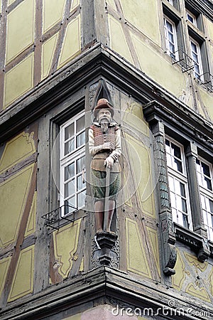 Wooden statue at a house in Colmar, Elzas, France Stock Photo