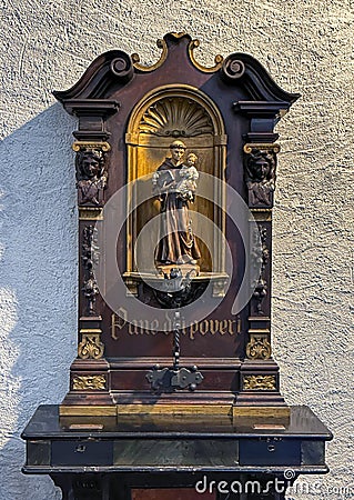 Wooden statue of Saint Anthony of Padua in the Church of Saint George in Varenna, Italy. Stock Photo