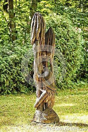 Wooden statue of three woman with long hair and big breast Editorial Stock Photo