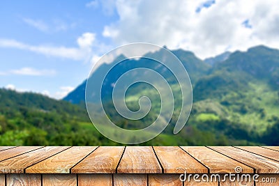 Wooden table on the beautiful mountain scenery. Stock Photo