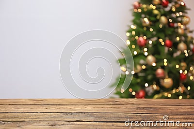 Wooden table and blurred Christmas tree Stock Photo