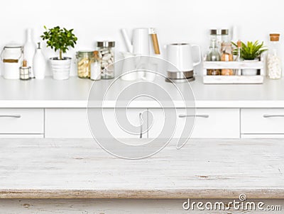 Wooden table with bokeh image of different kitchen common products Stock Photo