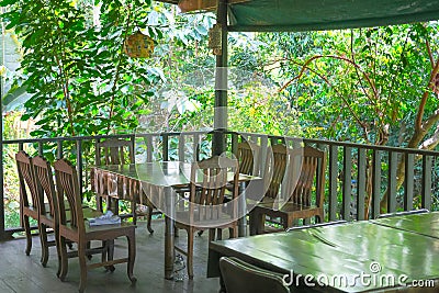 Wooden table and chair in countryside traditional restaurant Stock Photo