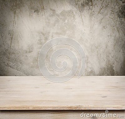 Wooden table on defocuced vintage wall background Stock Photo