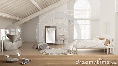 Wooden table, desk or shelf with crystal modern hourglass measuring the passing time and house keys over loft with bedroom and bat Stock Photo