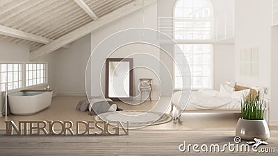 Wooden table, desk or shelf with potted grass plant, house keys and 3D letters, words interior design, over blurred loft with bedr Stock Photo