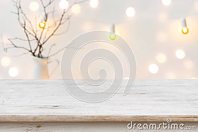 Wooden table in front of blurred abstract winter holiday background Stock Photo