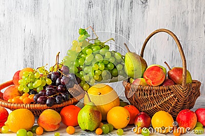 Wooden table full fresh fruit baskets Stock Photo