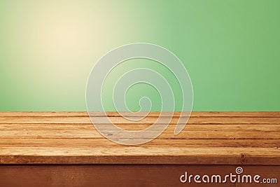 Wooden table and green background for product montage display Stock Photo