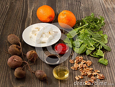 Wooden table of ingredients for beet salad with oranges and feta cheese Stock Photo