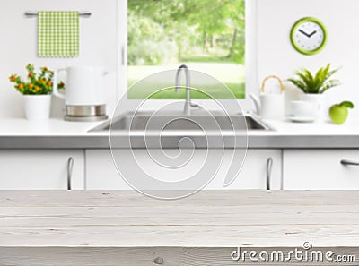 Wooden table on kitchen sink window background Stock Photo