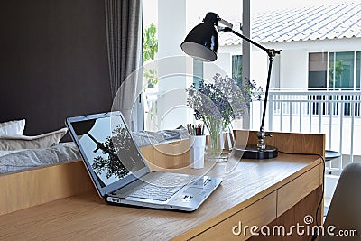 Wooden table in modern working area at home Stock Photo