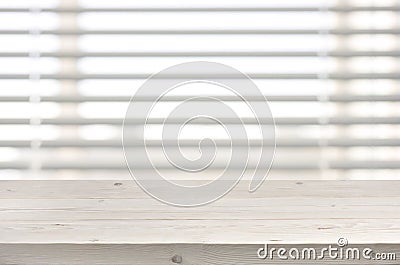 Wooden table from planks on window with venetian blinds background Stock Photo