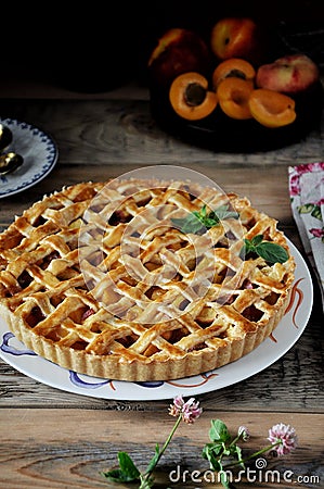 A plate a pie with apricots. Closeup Stock Photo
