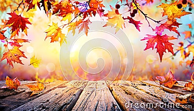 Wooden Table With Red Leaves Stock Photo