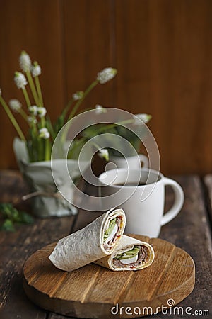 On a wooden table snacks rolls Stock Photo