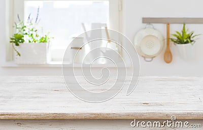 Wooden table top over blurred kitchen interior with copy space Stock Photo