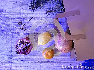 On a wooden table, a top view of a pomegranate from a shopping bag, a top view Stock Photo