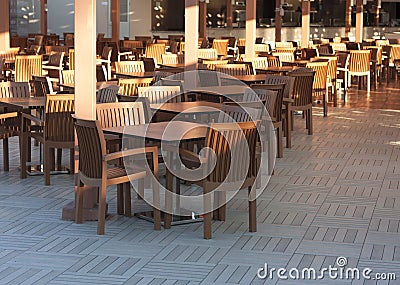 Wooden tables in outdoor restaurant photo Stock Photo