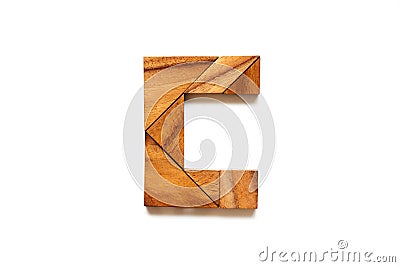 Wooden tangram puzzle as English alphabet letter C Stock Photo