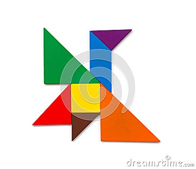 Wooden tangram shaped like a flying bird Stock Photo