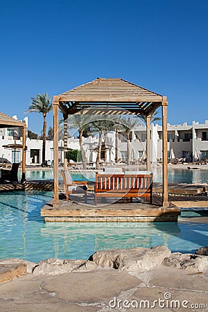 Wooden terrace landscape with relaxing benches on the beautiful hotel`s territory of Reef Oasis Beach Resort 5 Editorial Stock Photo