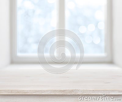 Wooden texture table surface over abstract frosty winter window background Stock Photo