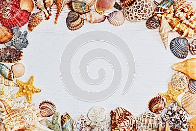 Wooden textured table with frame of sea shells Stock Photo