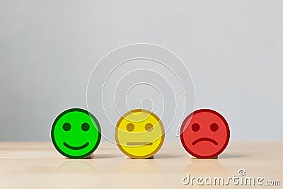 Wooden three coins with icon face Stock Photo