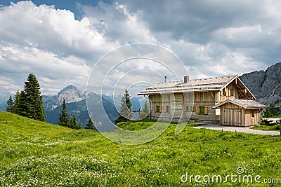 Wooden timber chalet house on austrian mountains Stock Photo
