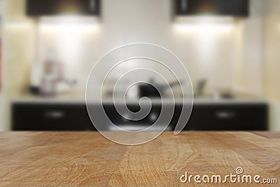 Wooden top table with blurred kitchen interior background Stock Photo