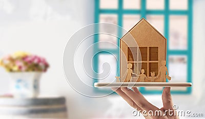 Wooden toy house. Mortgage property home concept. Buying house for family Stock Photo