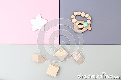 Wooden toys on pastels color background. Flat lay Stock Photo