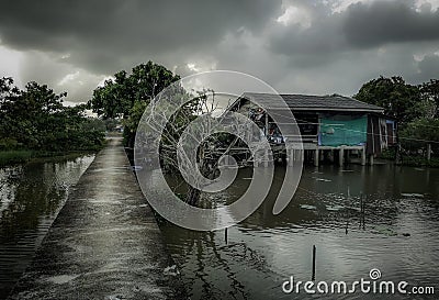 Wooden traditional thai house, stilt house, Thailand fisherman village and landscape Stock Photo