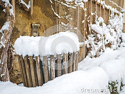 Wooden trash can covered with snow in mirabellplatz austria salzburg winter season background wall Stock Photo